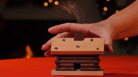 Lighting incense cone and setting down ornament Видео 122263930