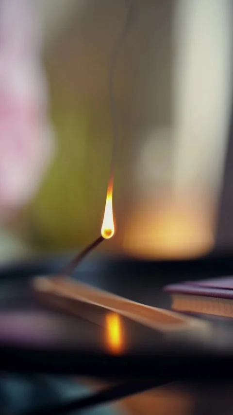 Lighting an incense stick with match in slow motion Vídeos de archivo 331775204