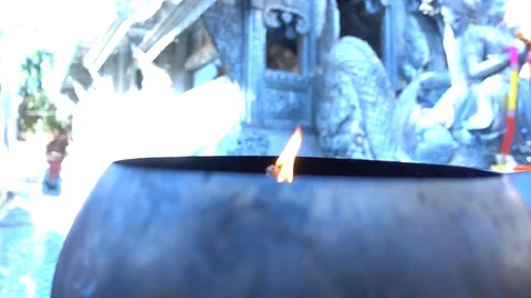 Lighting incense sticks in temple Stock Footage 100661552