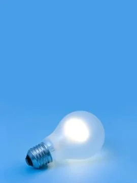 Lighting lamp on blue background Stock Photos