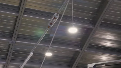 Lighting in a large modern service station with a metal roof. Vídeo Stock 256073690