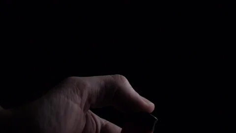 Lighting up lighter in dark Stock Footage 107441636