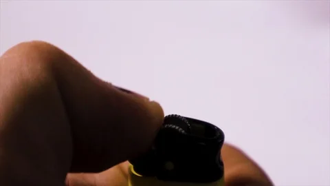 Lighting a lighter on a white background 库存影片 111375600