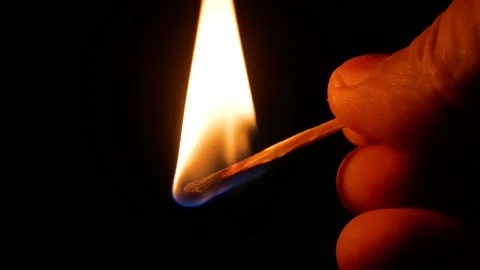 Lighting a match against a matchbox in the dark. Stock Footage 147102276