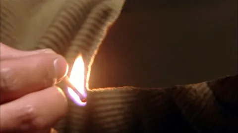 Lighting a match and burning documents Stock Footage 316815318
