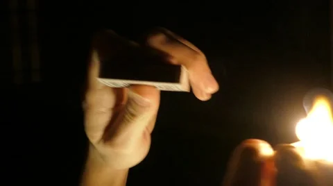 Lighting match on black background, 4k Stock Footage 60747810