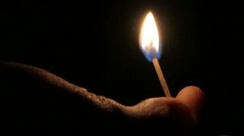 Lighting match on black background in close up, 4k Stock Footage 60747871