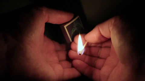Lighting a match in a dark room 01 Stock Footage 34977458