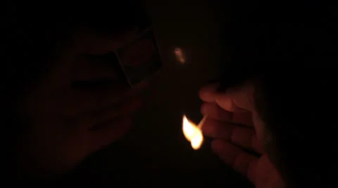 Lighting a match in a dark room 02 Stock Footage 34977450