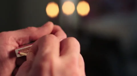Lighting a match Stock Footage 976219