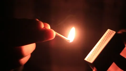 Lighting a match Stock Footage 10790473