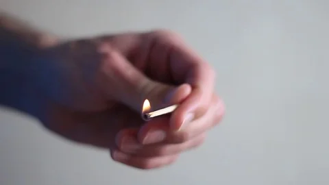 Lighting match in man's hands 스톡 동영상 71953325