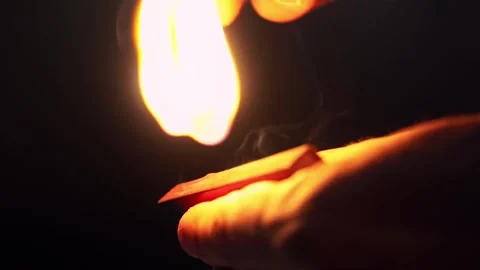 Lighting a matchstick Full HD 60fps slowmotion Video stock 322989930