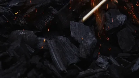 Lighting Methylated Spirits On Coal With A Match In A Bbq Grill