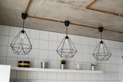 Lighting on a modern kitchen in comfortable apartment. Vintage luxury interior Stock Photos