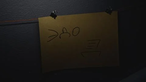 Lighting of notes on wall. Stock footage. Lantern illuminates notes in night Stock Photos