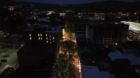 Lighting Pedestrian zone of small american town at night. Lights in windows of Video stock 307640696