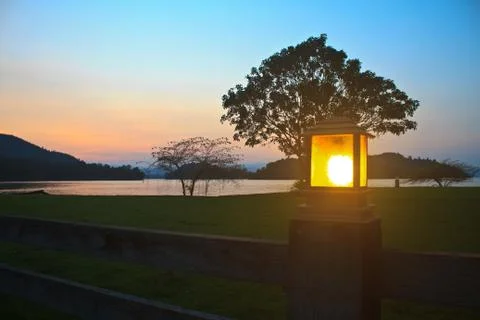 Lighting pole and sunset at camping ground Stock Photos
