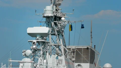 Lighting, radar equipment and flags on the mast of a NATO ship Stock Footage 119411284