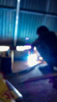 Lighting rays coming from the weldding work Stock Photos