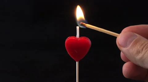 Lighting a red candle 4K Vídeo Stock 47212813