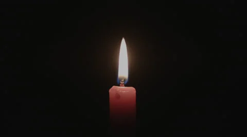 Lighting a Red Candle and Blowing it Out Stock Footage 39375937