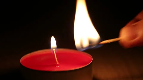 Lighting up red candle Stock Footage 46842921
