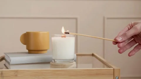 Lighting a Scented Candle on a Side Table - 4K Video Video stock 340473287