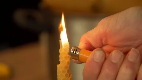 Lighting a self made wax candle  Stock Footage 74057239