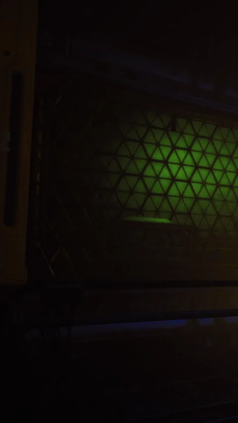 Lighting shines through a geometric pattern at night in urban setting Stock Footage 330341390
