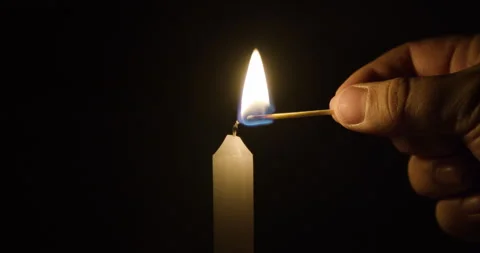 Lighting Single Candle in the dark Stock Footage 251417506
