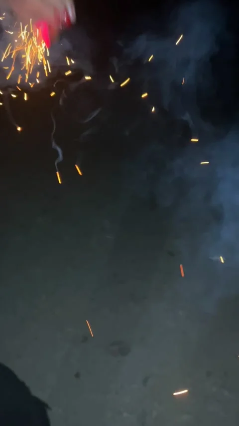 Lighting a sparkler and throwing it, festive firework ignition Vídeos de archivo 336135900