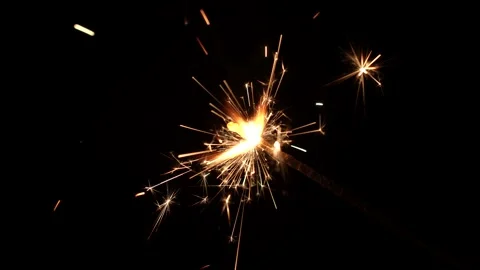 Lighting sparkler on black background, 4k Stock Footage 256977728