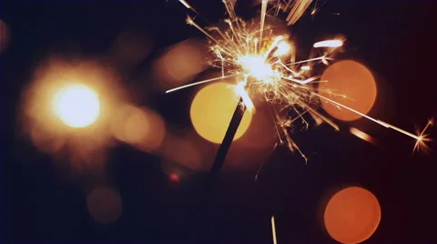Lighting Sparkler close up with a blurred background Video stock 62903312