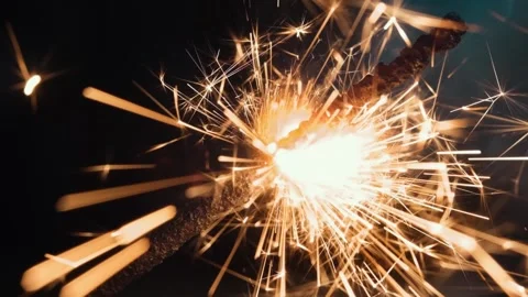 Lighting a sparkler with a match macro in slow motion Video stock 143000618