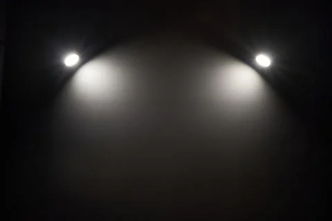 Lighting spots on the wall with space for text Foto stock