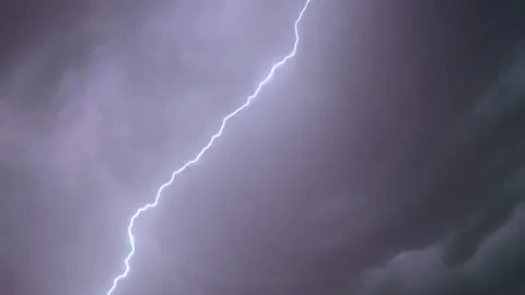 Lighting storm clouds in sky at night during a thunderstorm Stock Footage 239525773