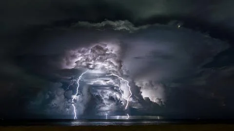 Lighting storm in the ocean Stock Photos