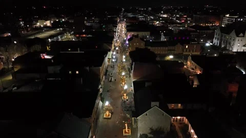 Lighting straight street in small town of USA at night. Chain of lights Stock Footage 296584076