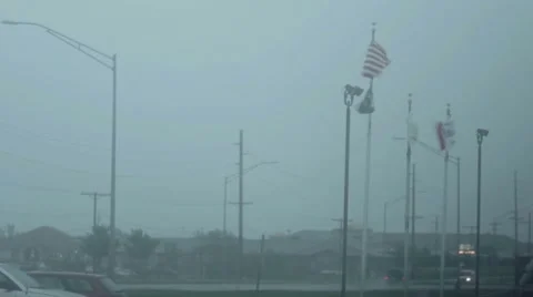 Lighting strikes behind American Flag Stock Footage 7766917