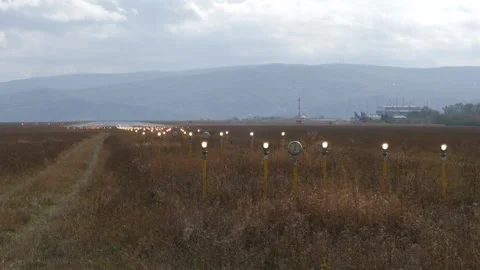 Lighting system that flashes intermittently at the end of the runway. Stock Footage 257018647