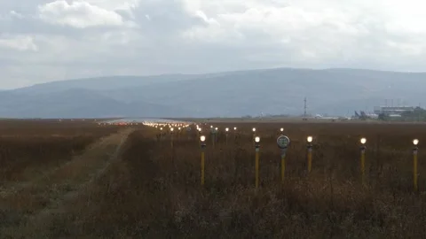 Lighting system that flashes intermittently at the end of the runway. Stock Footage 257018751