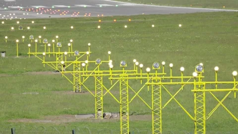 Lighting systems along airport runways assist with flight safety and navigation Stock Footage 335619698