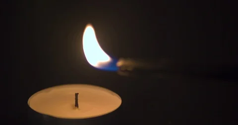 Lighting a Tea Candle Stock Footage 101360925