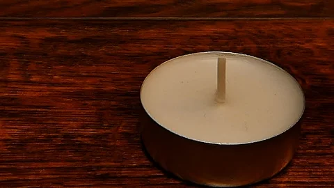 Lighting a Tea Candle with a Match – Close-up Stock Footage 102390584