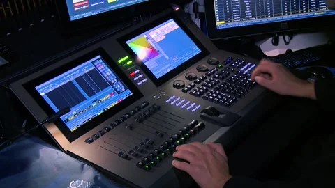 Lighting technician operating light console board during the live concert Stock Footage 144430917