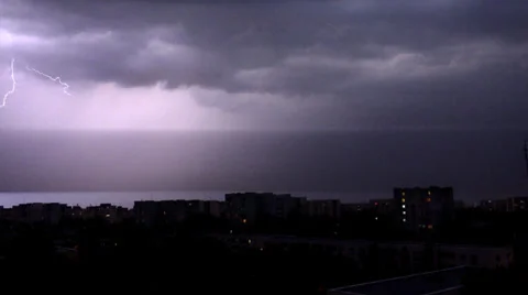 Lighting, Thunderbolt over Buildings in City, Raining in Town, Storm in Night 4K Stock Footage