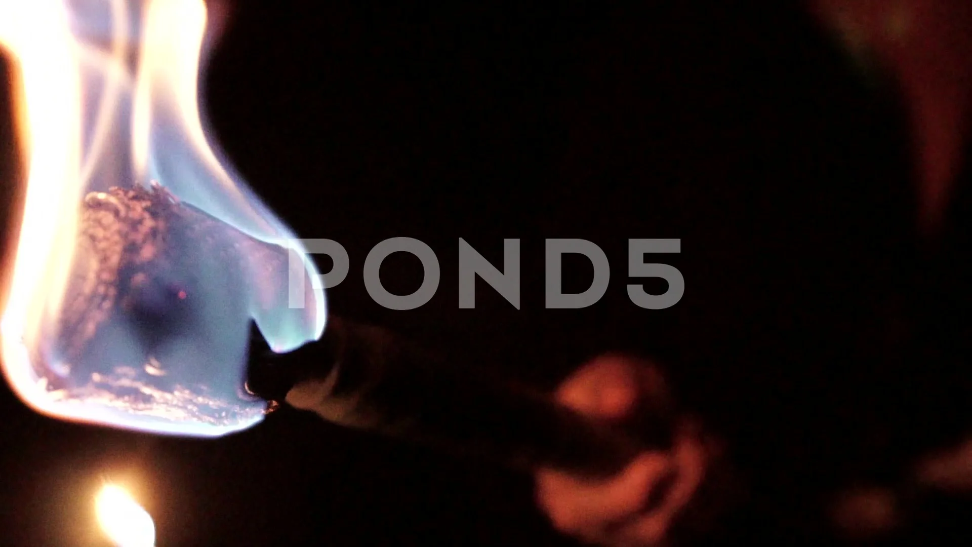 Lighting a Torch in the Dark in Slow Mot... | Stock Video | Pond5