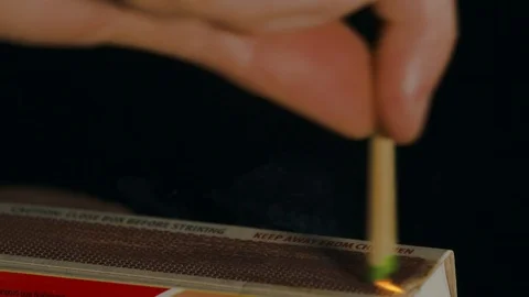 Lighting Two Matches on Matchbox Slow Motion 01 Stock Footage 117367135