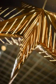 Lighting unit made in the form of a large gold star in the art Nouveau style, Stock Photos